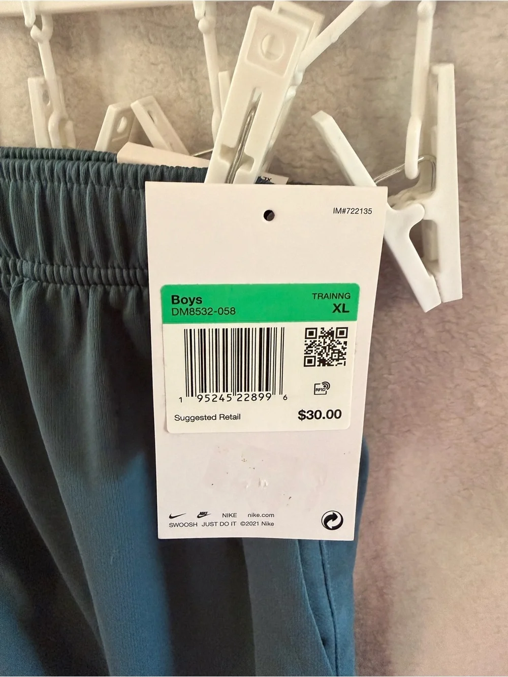 Nike Youth Teal Athletic Shorts with orange Logo Accent